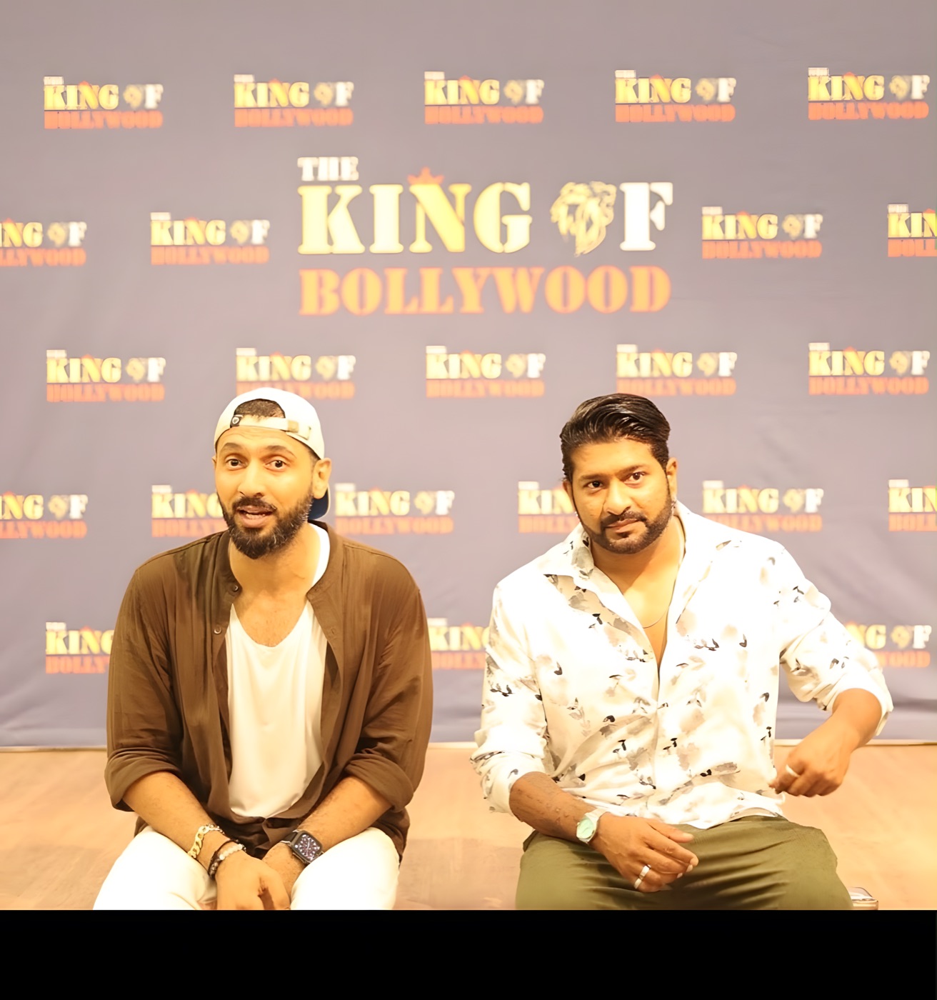 Our founder with Bollywood choreographer Punit Pathak in front of the TKOB backdrop